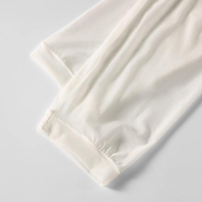 Close-up detail of ice silk fabric used in white men’s baselayer set