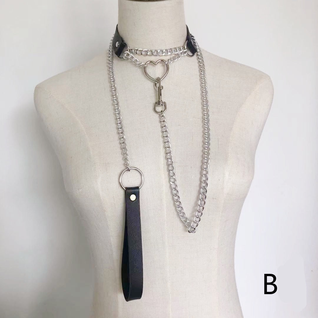 Black faux leather choker with chain accent and adjustable buckle