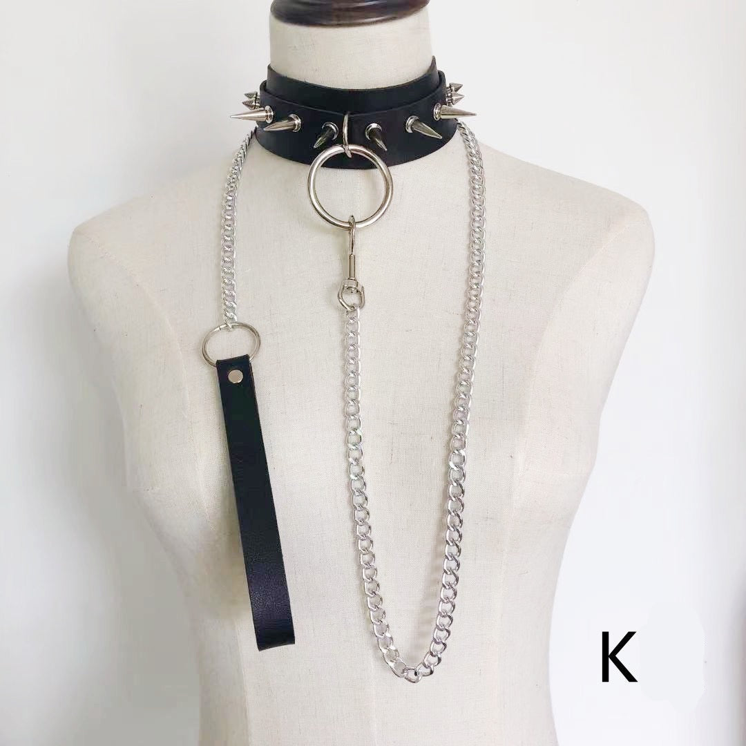 Faux leather choker featuring spike details