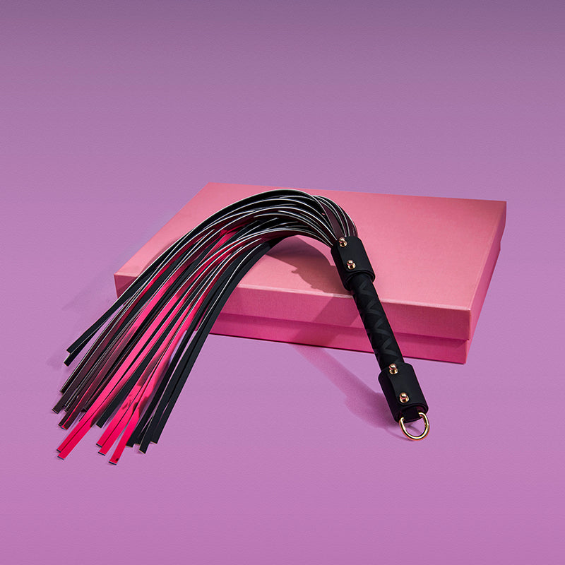 Handmade heat reactive leather tassel accessory displayed with partial color change effect