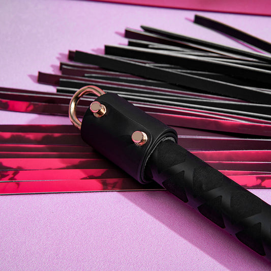 Close-up detail of heat reactive leather panels and metal hanging ring