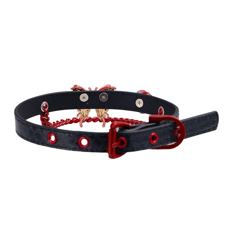 Back view of genuine leather butterfly choker featuring red rose detail and decorative chain accents