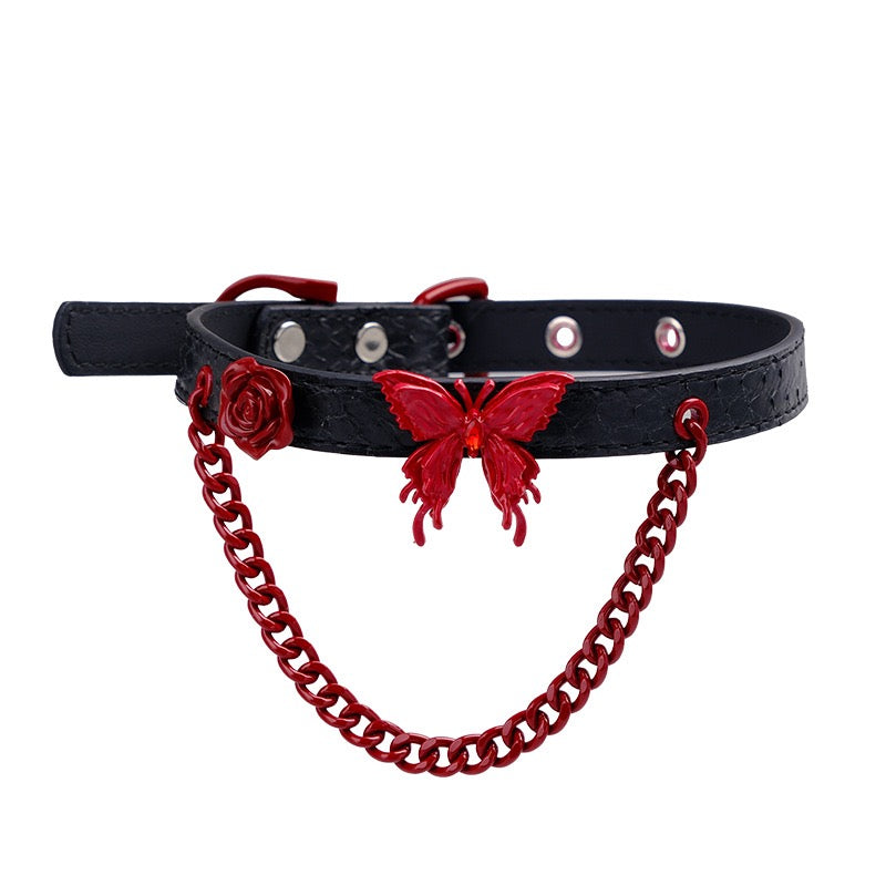 Genuine leather butterfly choker featuring red rose detail and decorative chain accents