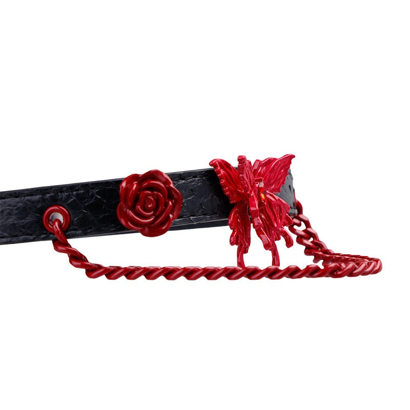 Close-up detail of red rose hardware and adjustable leather construction