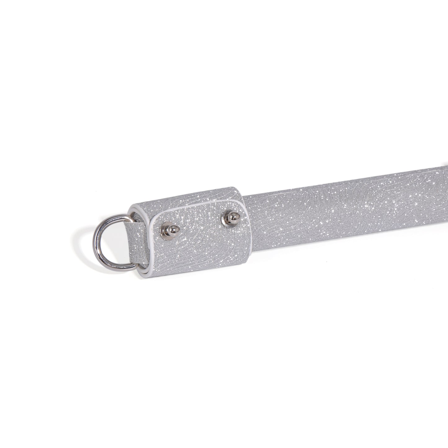Close-up detail of metal ring and handle hardware on Ever Gleam performance tassel