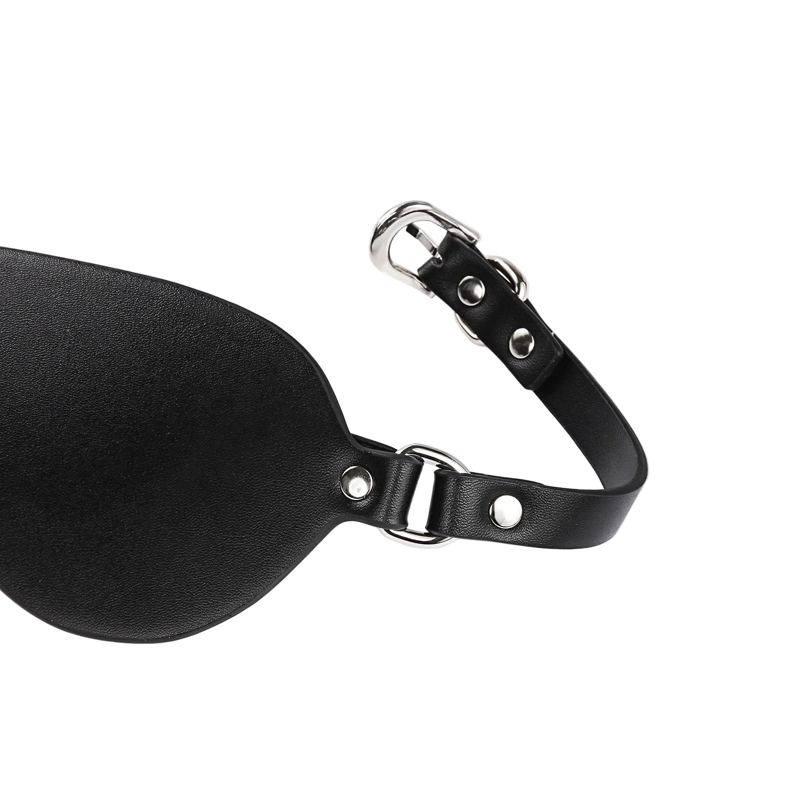 Close-up detail of faux leather material and metal hardware on eye mask