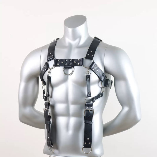 Front detail view of black faux leather harness suspender with metal rings and adjustable straps