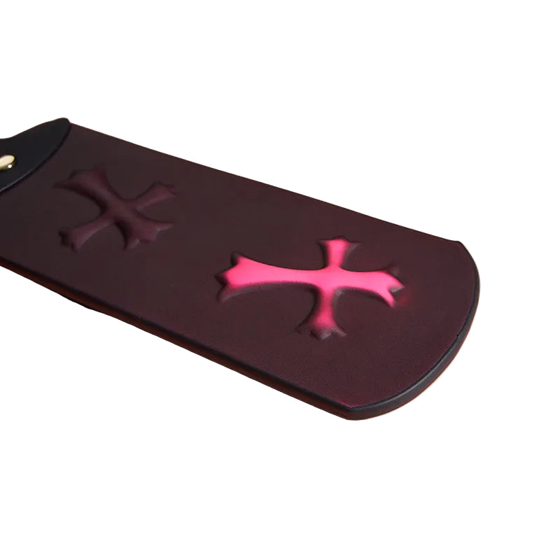 Close-up detail of thermochromic faux leather showing color shift on cross patterned paddle 