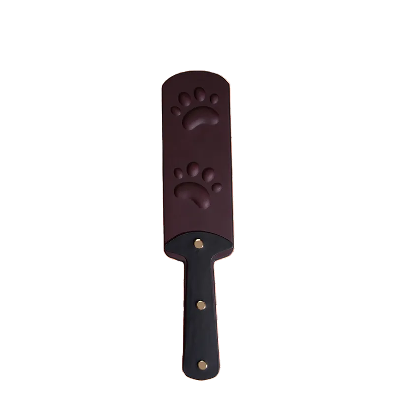 Heat reactive faux leather paddle featuring embossed paw pattern