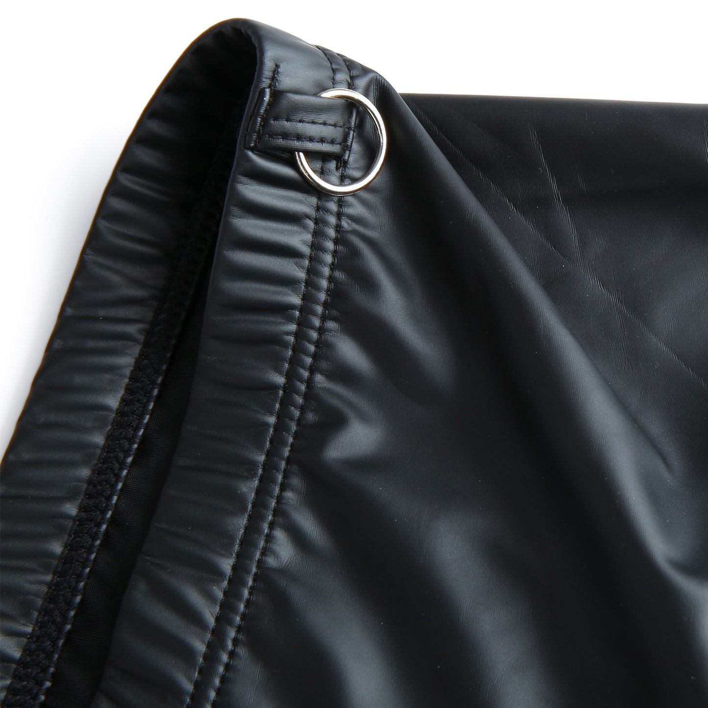 Close-up detail of metal hardware on boxer waistband