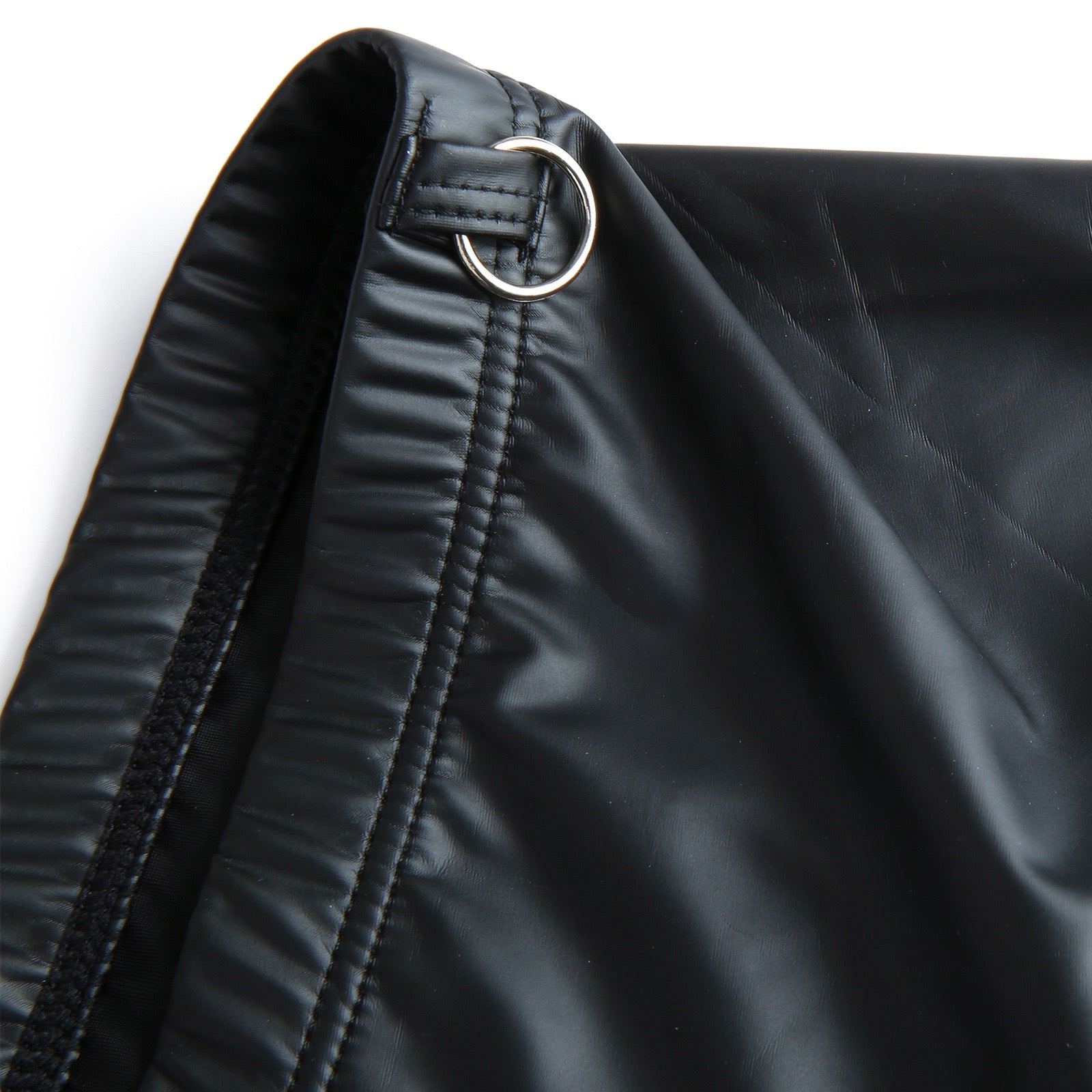 Close-up detail of metal hardware on boxer waistband