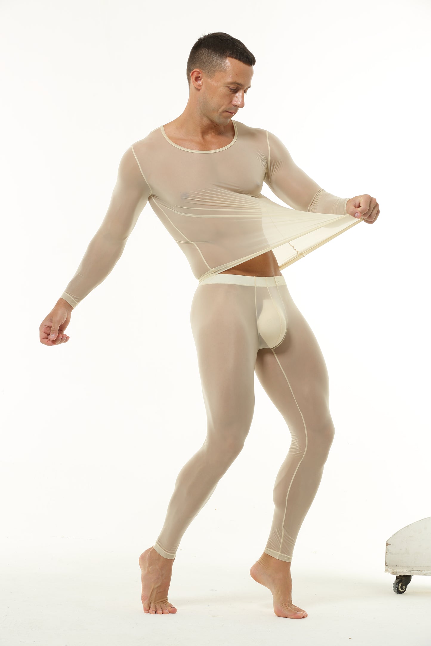 Beige men’s baselayer set demonstrating fabric stretch and flexibility