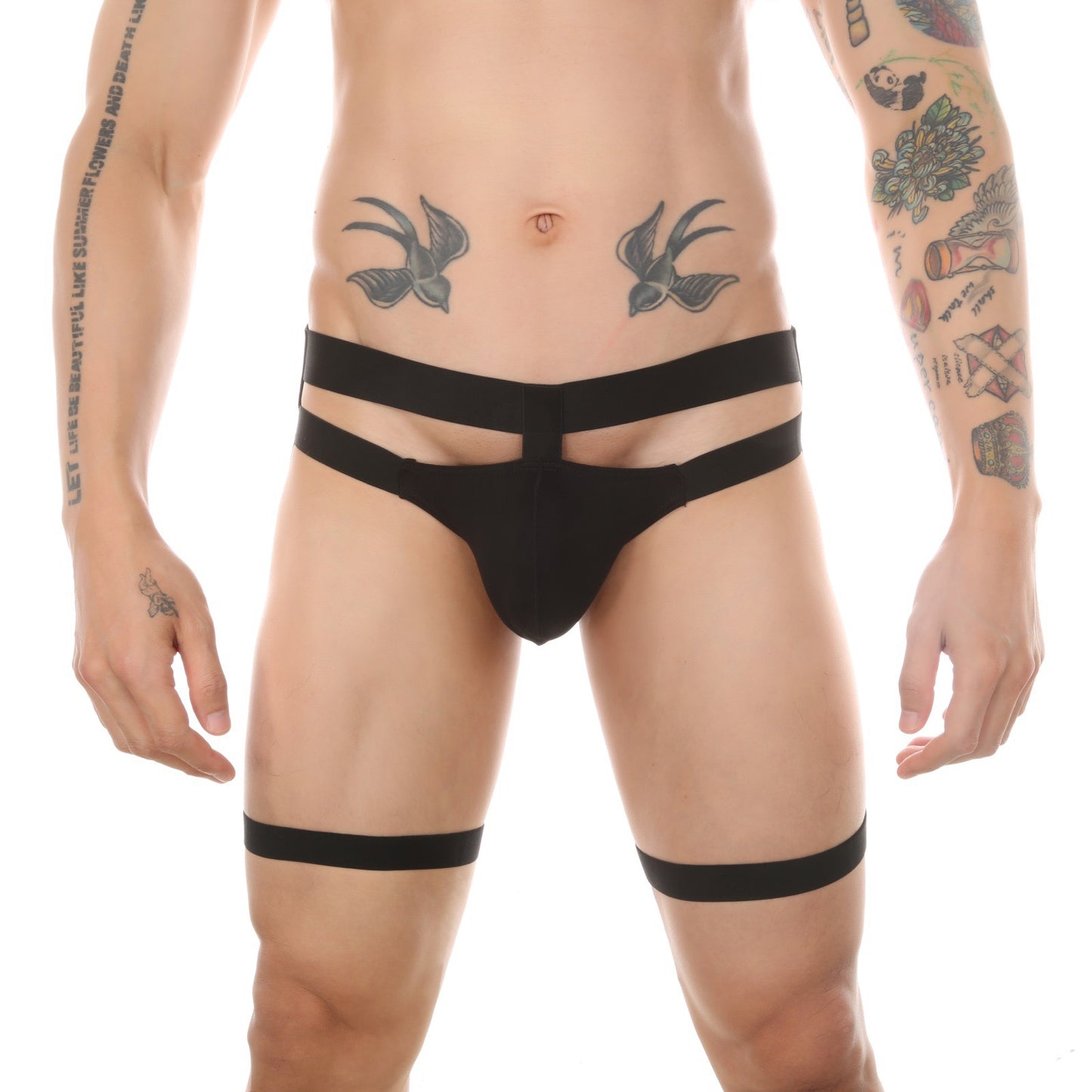 Front view of black men’s minimalist garter thong worn by model