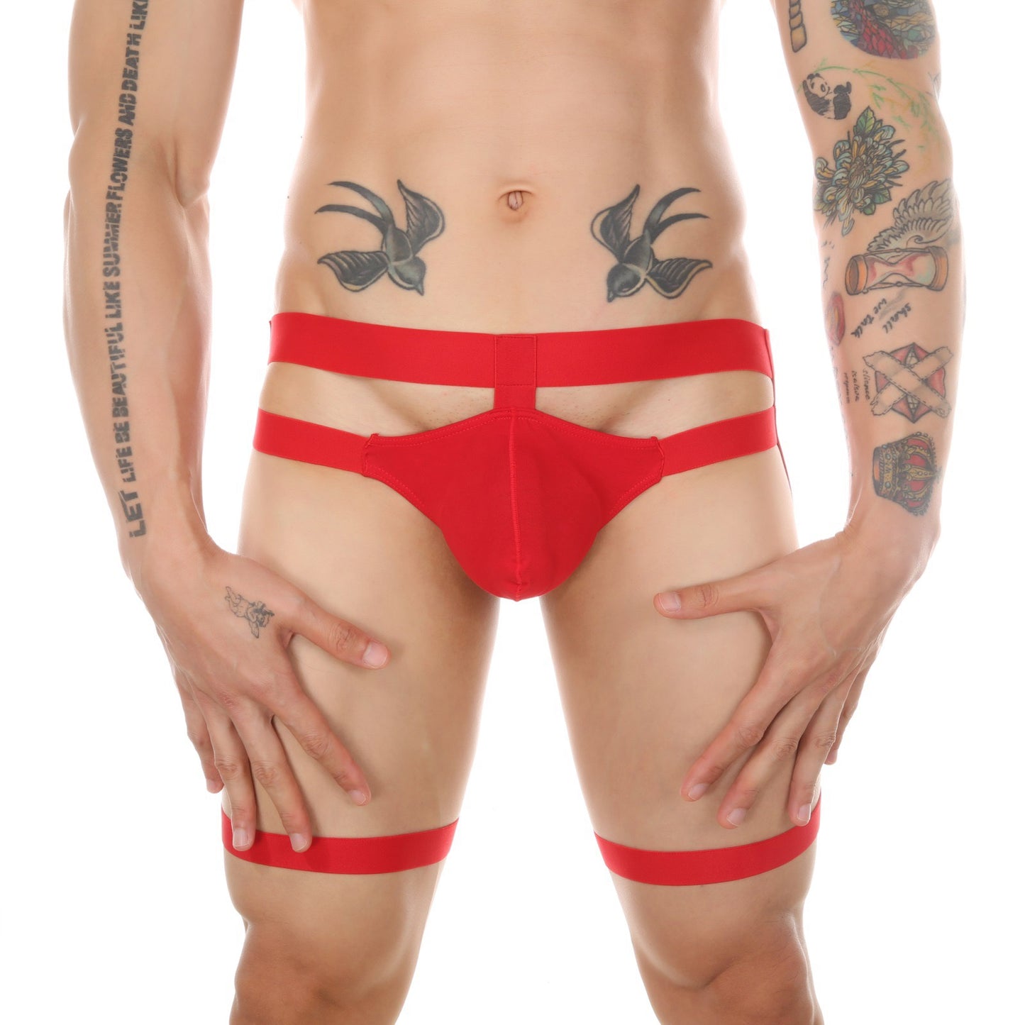 Front view of red men’s minimalist garter thong worn by model