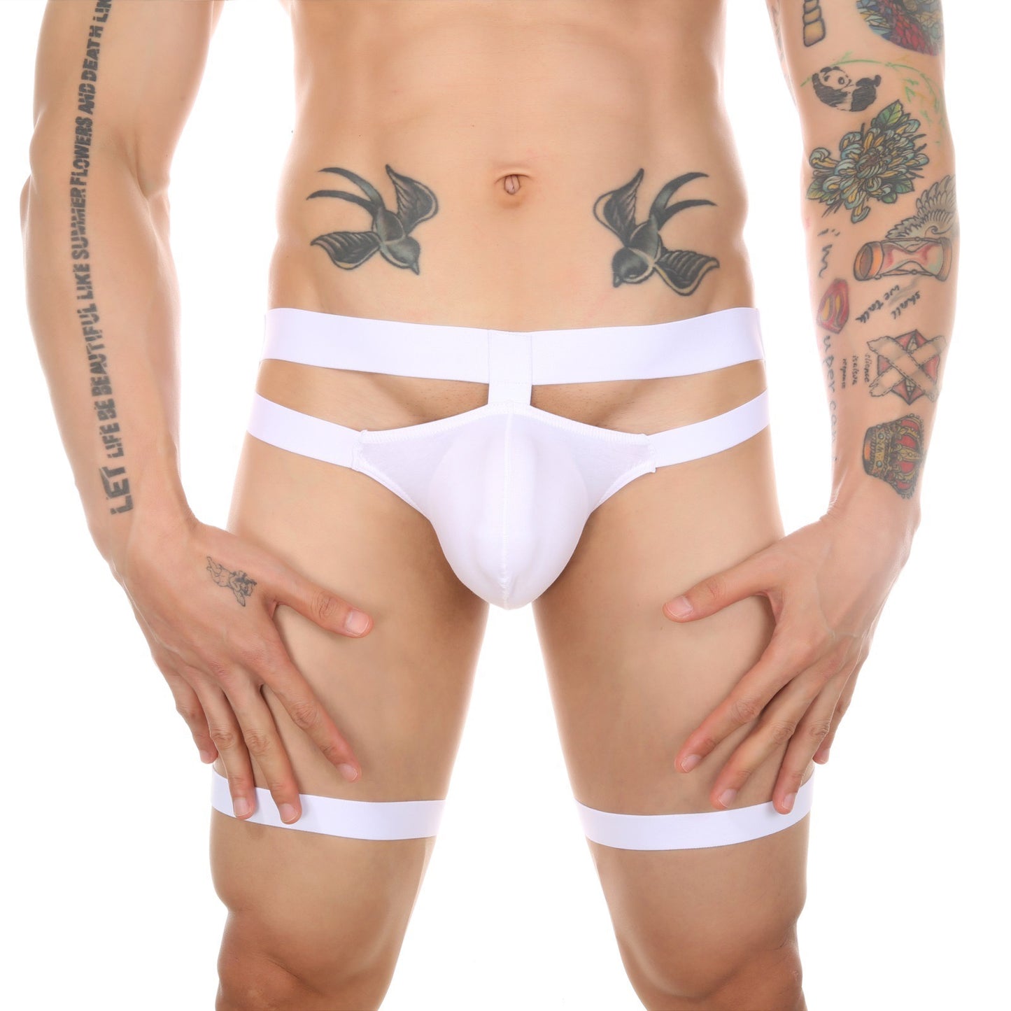 Front view of white men’s minimalist garter thong worn by model