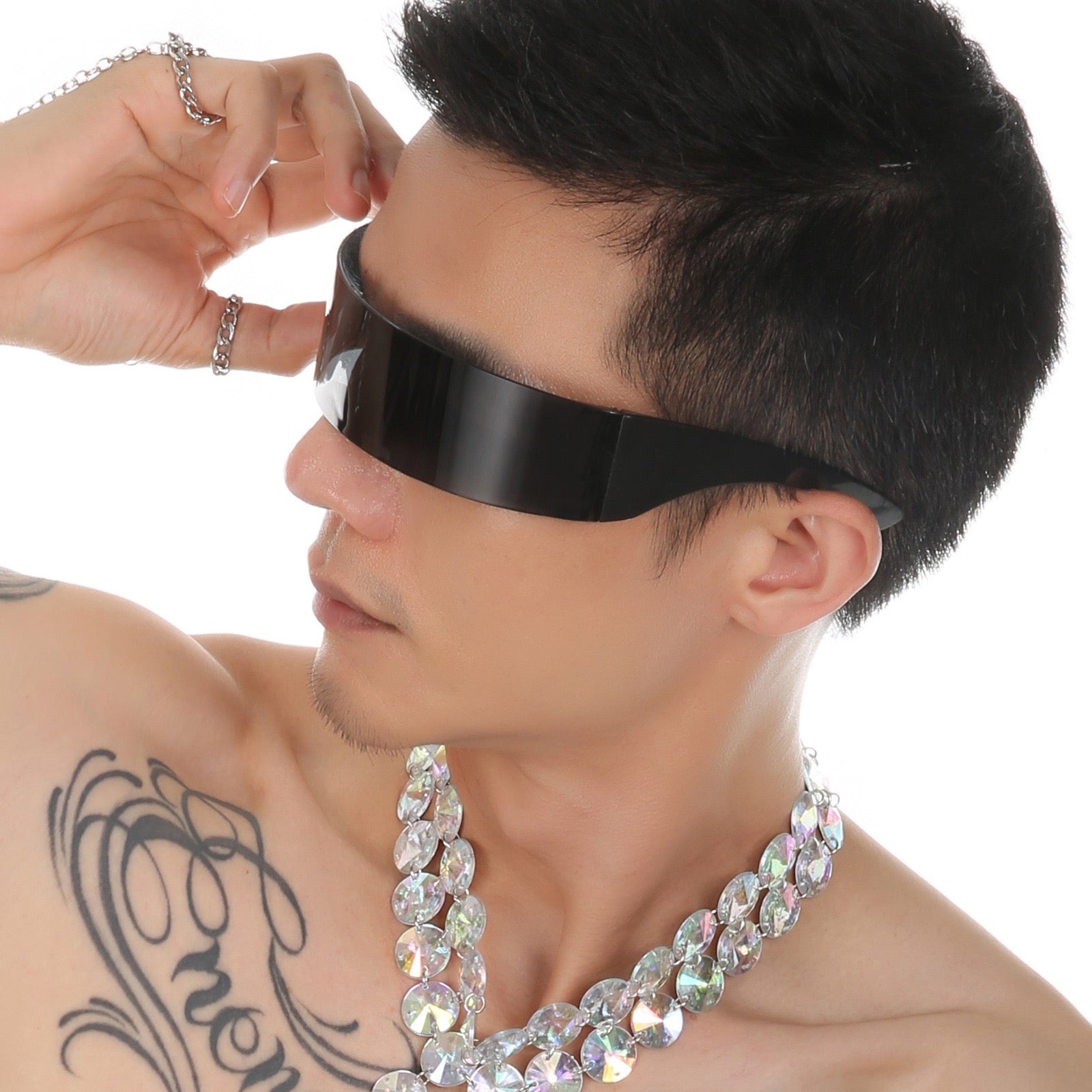 Model wearing black futuristic shield visor sunglasses