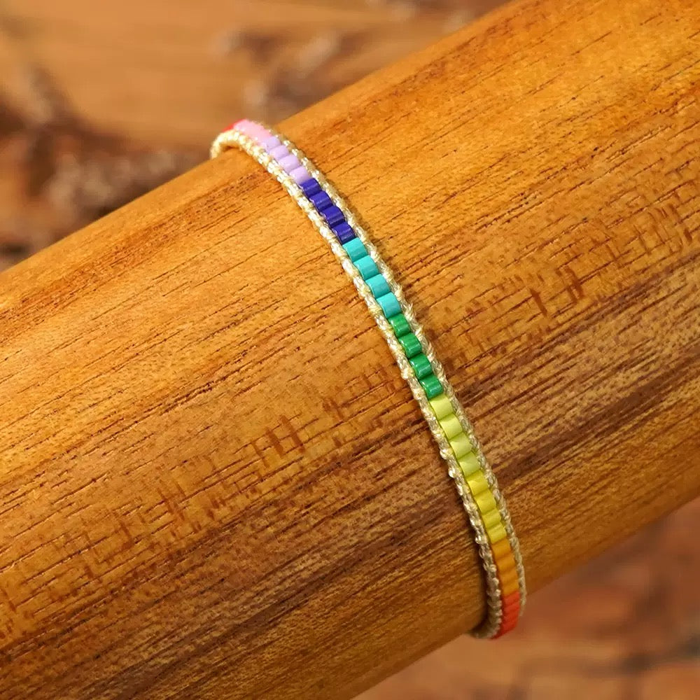 Handmade pride bracelet displayed to show length and fit