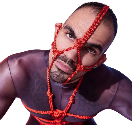 Front view of red rope head harness with structured detailing