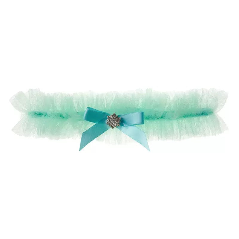 Green stretch rhinestone bow leg accessory with decorative rhinestone bow